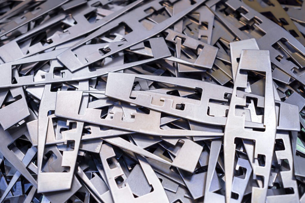 Metal plates after processing on die-cutting press.